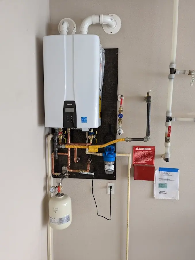 Professional plumber installing copper piping in a Ivanhoe home